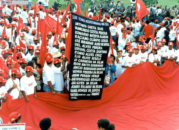 Landless rural workers display poster with the names of the 19  ...